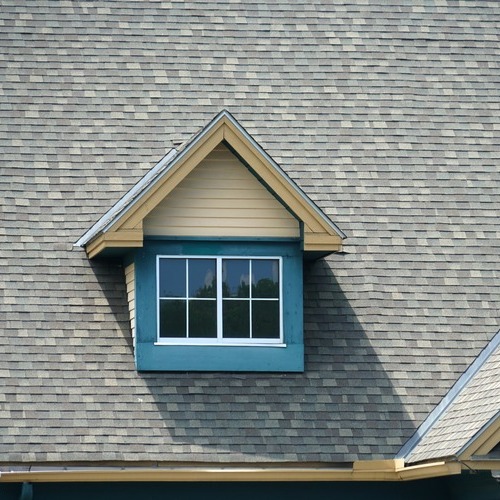 gable with windows on a shingle roof