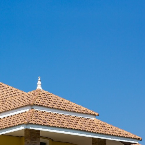 tile roofing system against a blue sky